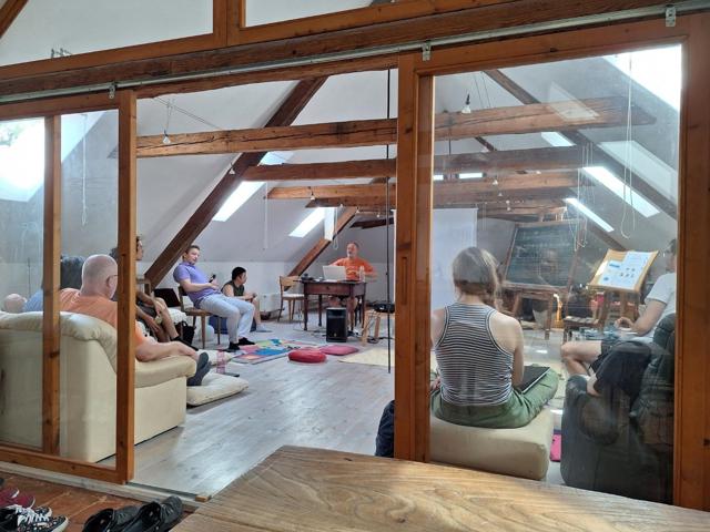 View through glass sliding doors into a workshop in the attic