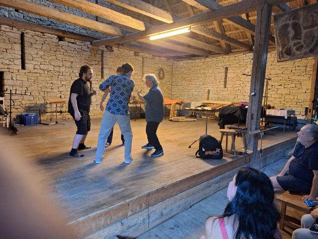 Improvisation on a wooden stage in a stone barn