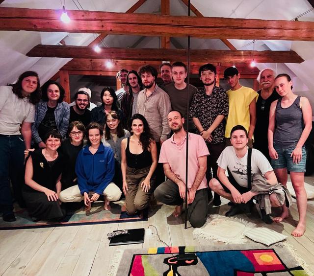 Group photo of participants in the attic studio
